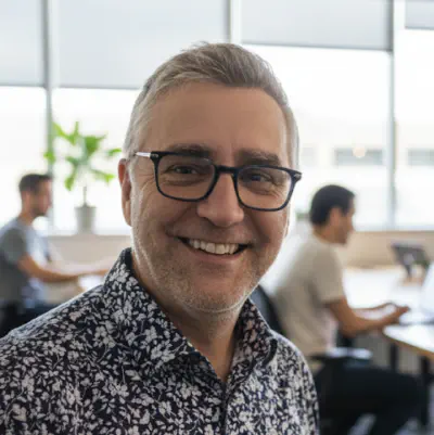 a headshot showing Dylan in an office environment